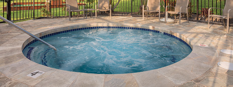 Hot Tub with a scenic view of the ocean at the Kona Coast Resort